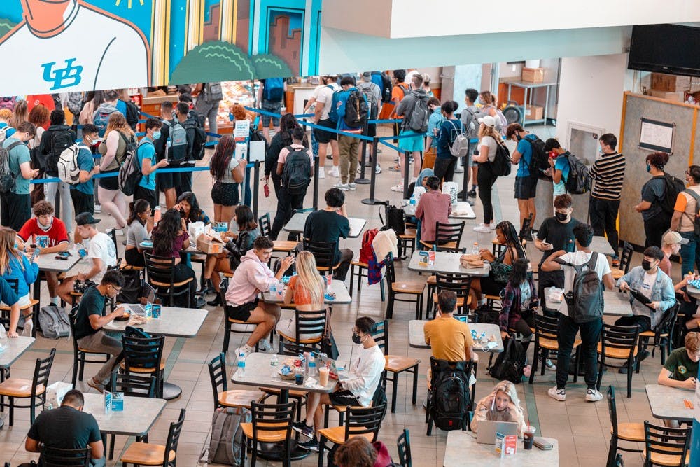 Students grab food, chat with friends and do work at the Student Union this fall.