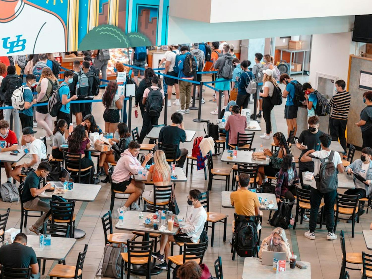 Students grab food, chat with friends and do work at the Student Union this fall.