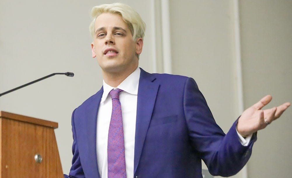 <p>Controversial journalist Milo Yiannopoulos speaks at Rutgers University in February, where students protested his speech. Yiannopoulos will no longer be speaking at UB this May.</p>