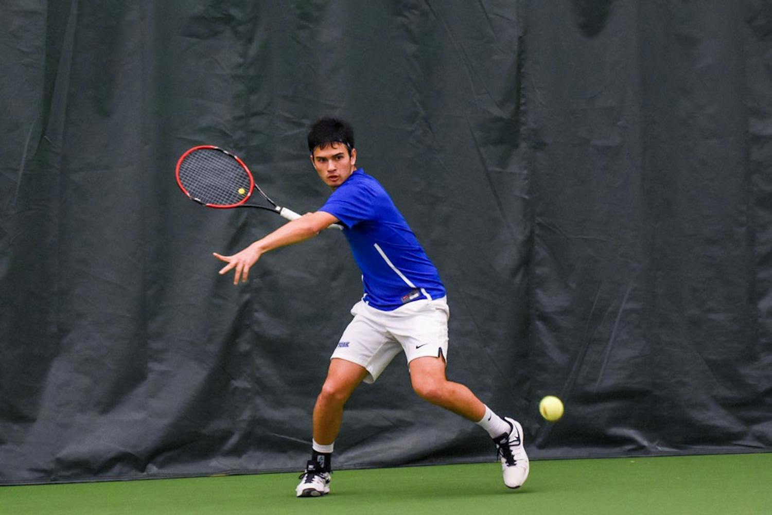 Senior Pablo Alvarez gets ready to return a ball during a match at the Miller Tennis Center. The men's tennis team is preparing for its regular season finale before the MAC Tournament.&nbsp;