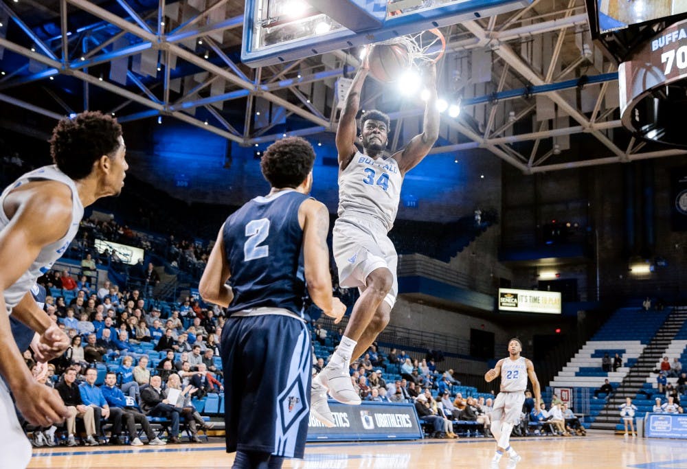 <p>Junior forward Ikenna Smart slamming home a dunk for the Bulls.</p>