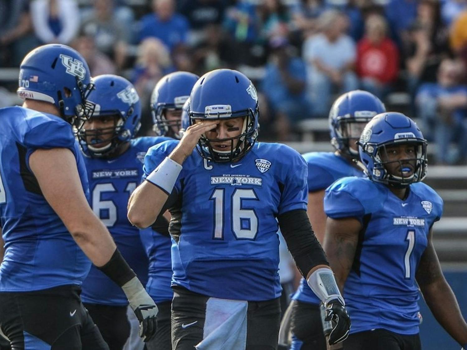 Former Bulls quarterback Joe Licata, with "New York" featured prominently on his jersey,&nbsp;walks off the field during a loss to Nevada at UB Stadium in September of 2015.&nbsp;Licata preferred the jerseys with the "Buffalo" patch that the team wore during his freshman season.&nbsp;