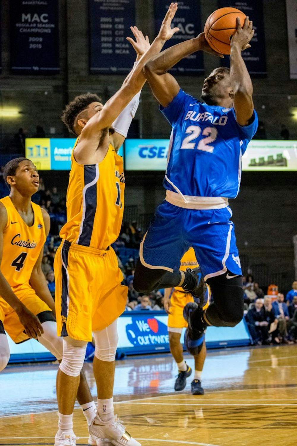 <p>Senior guard Dontay Caruthers jumps to make the shot in the paint. Basketball was given 14 votes in the first Associated Press Top 25 of the season.</p>