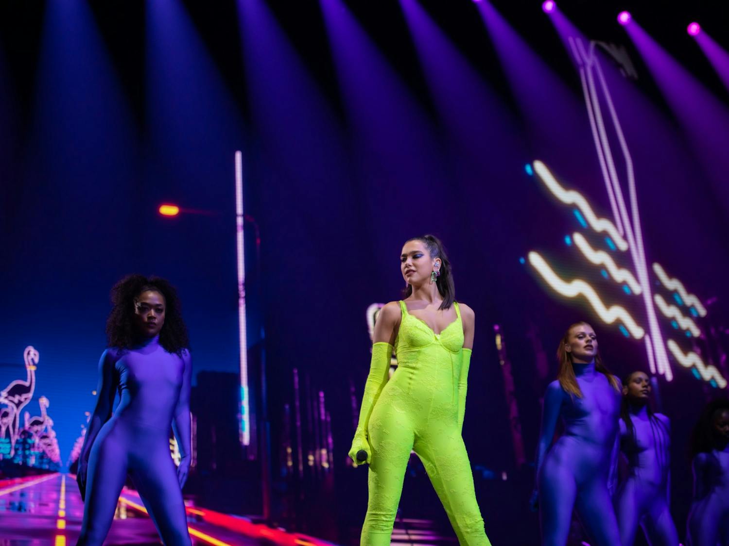 Dua Lipa poses while performing in front of backup singers Saturday at KeyBank Center.&nbsp;