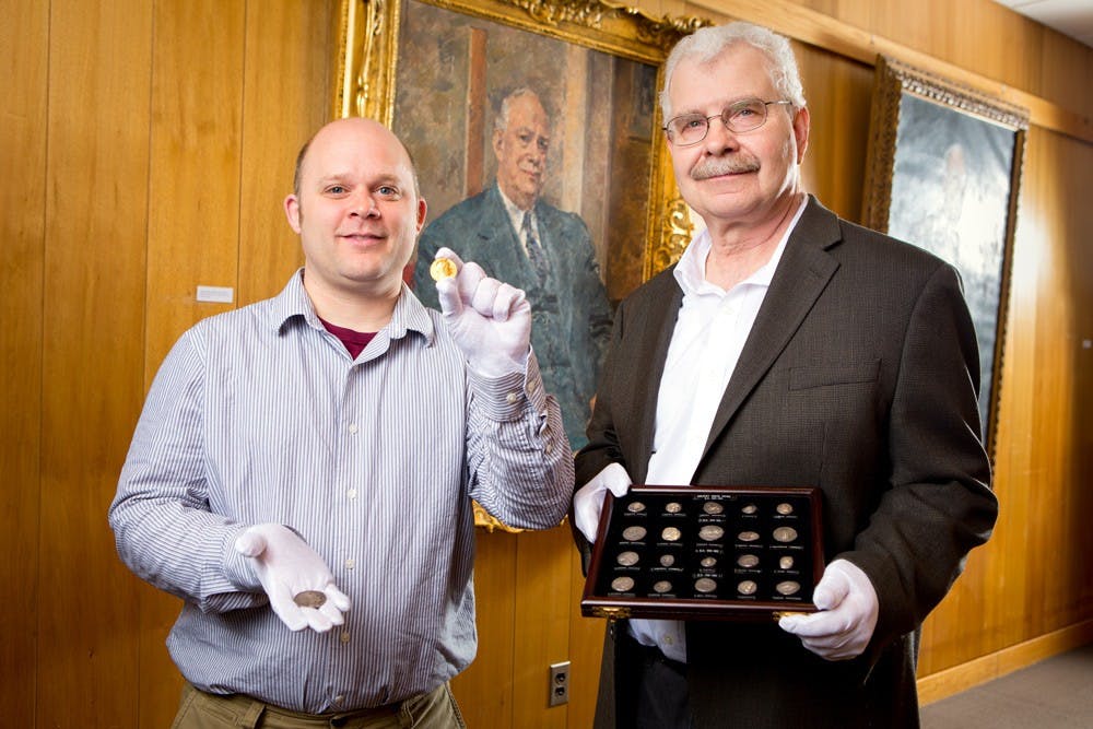<p>(Left) Philip Kiernan, (right) Michael Basinski. Michael Basinski is retiring after 32 years as the&nbsp;curator of the poetry collection. In 2015 he was named the Director of the Special Collections&nbsp;and will maintain that title after his retirement.</p>