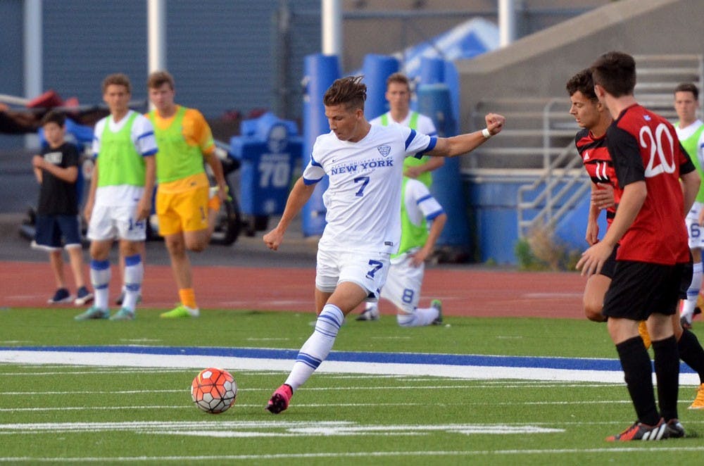 <p>Senior forward Russell Cicerone strikes a long shot against Seton Hill University.</p>