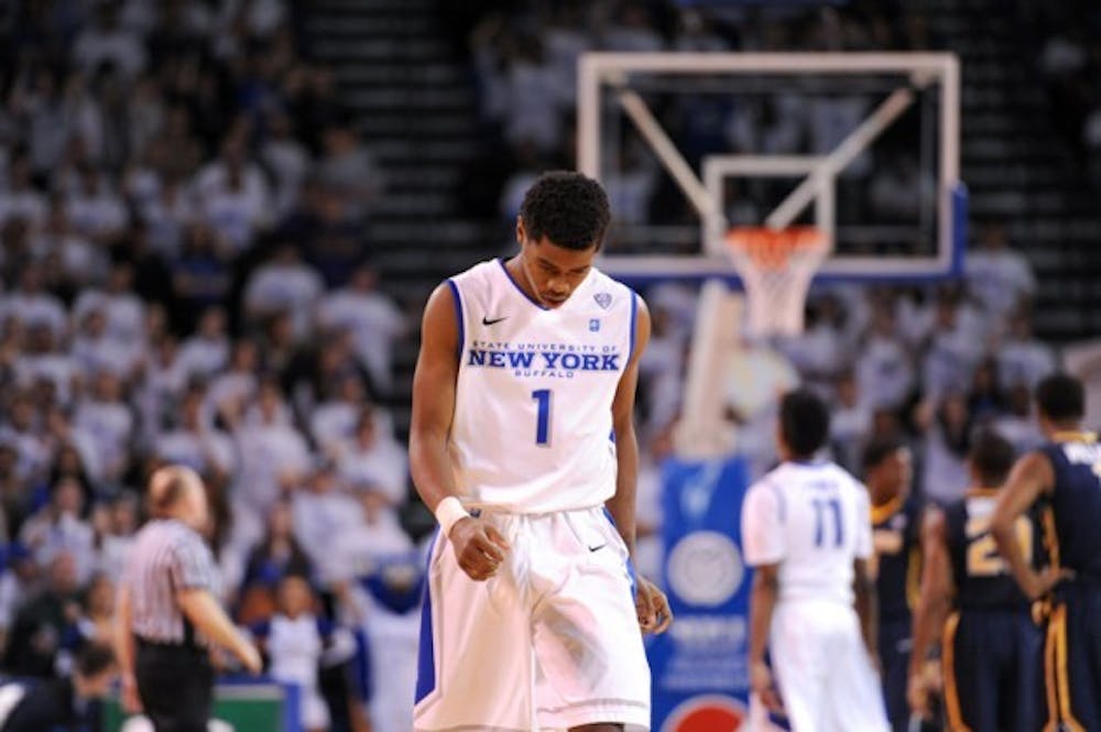 <p>Sophomore guard Lamonte Bearden looks down solemnly in loss against Toledo last season. Bearden was suspended for Buffalo's game Tuesday night for conduct detrimental to the team.&nbsp;</p>