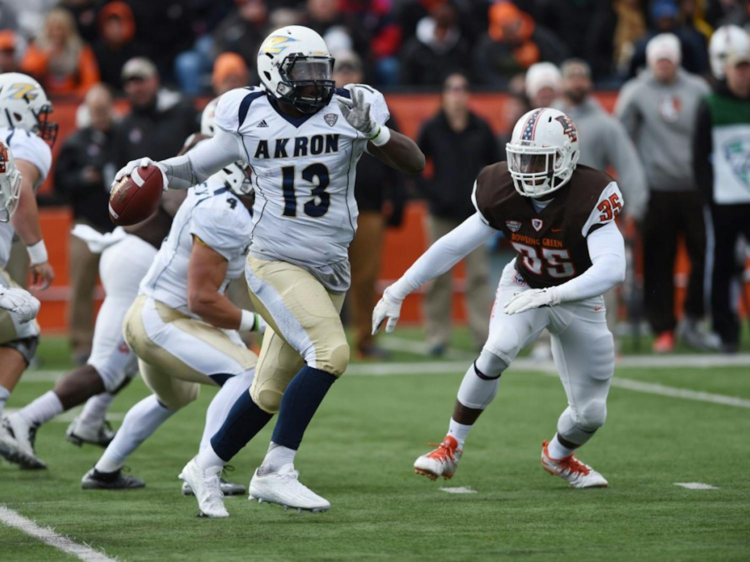 Akron quarterback Thomas Woodson throws a pass with a Bowling Green blitz coming. Buffalo enters Akron on Saturday just one win away from Bowl eligibility.