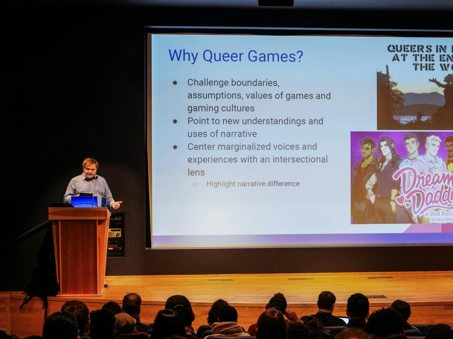 Assistant professor Cody Mejeur, Ph.D. lectures students on narrative video games involving the topics of gender and queer narrative to UB students Monday night at the Center for the Arts.
