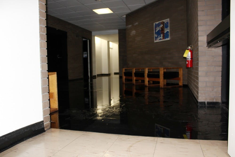 The fourth floor lobby of Clemens hall is flooded as a  result of a burst water valve on the fourth floor cooling system. 