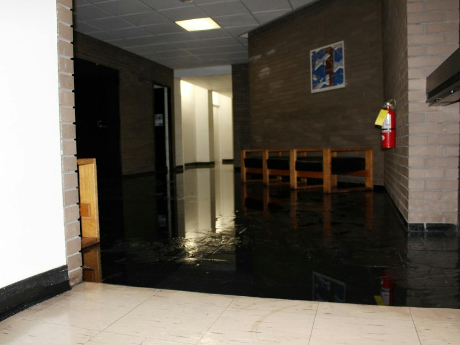 The fourth floor lobby of Clemens hall is flooded as a  result of a burst water valve on the fourth floor cooling system. 