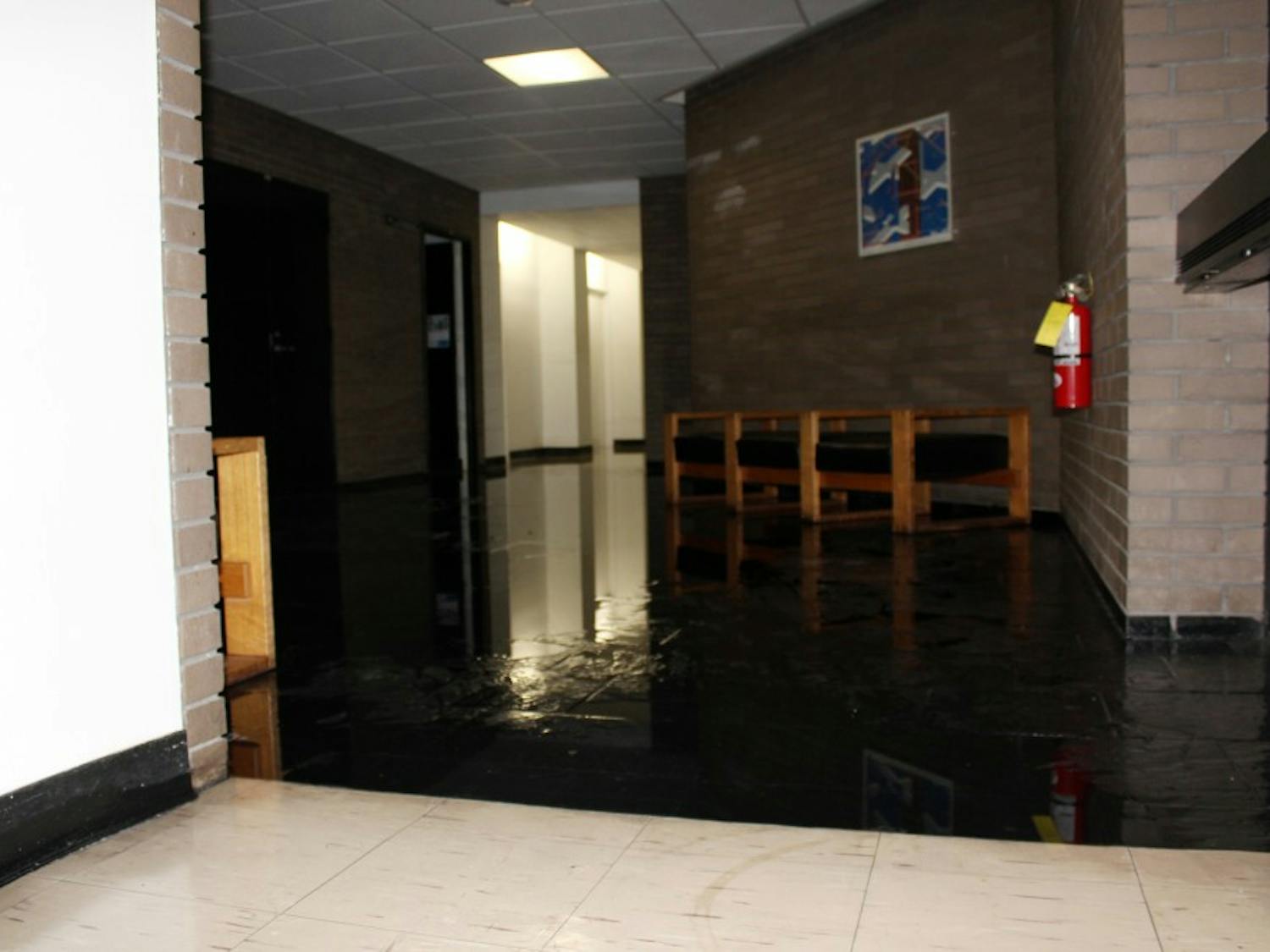 The fourth floor lobby of Clemens hall is flooded as a result of a burst water valve on the fourth floor cooling system.