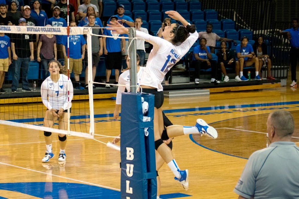 <p>Freshman outside hitter Andrea Mitrovic gets ready to spike the ball. The Bulls are looking to close the season strong despite recent loss to the Ohio Bobcats.</p>