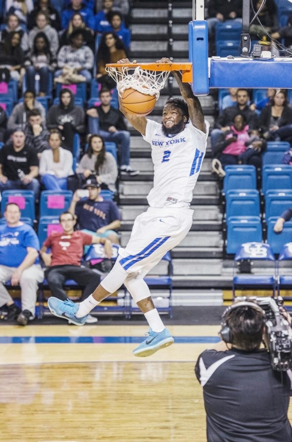 <p>Junior wing Willie Conner slams down the ball during Bulls Madness. Conner is one of many new players for the Bulls this season.&nbsp;</p>