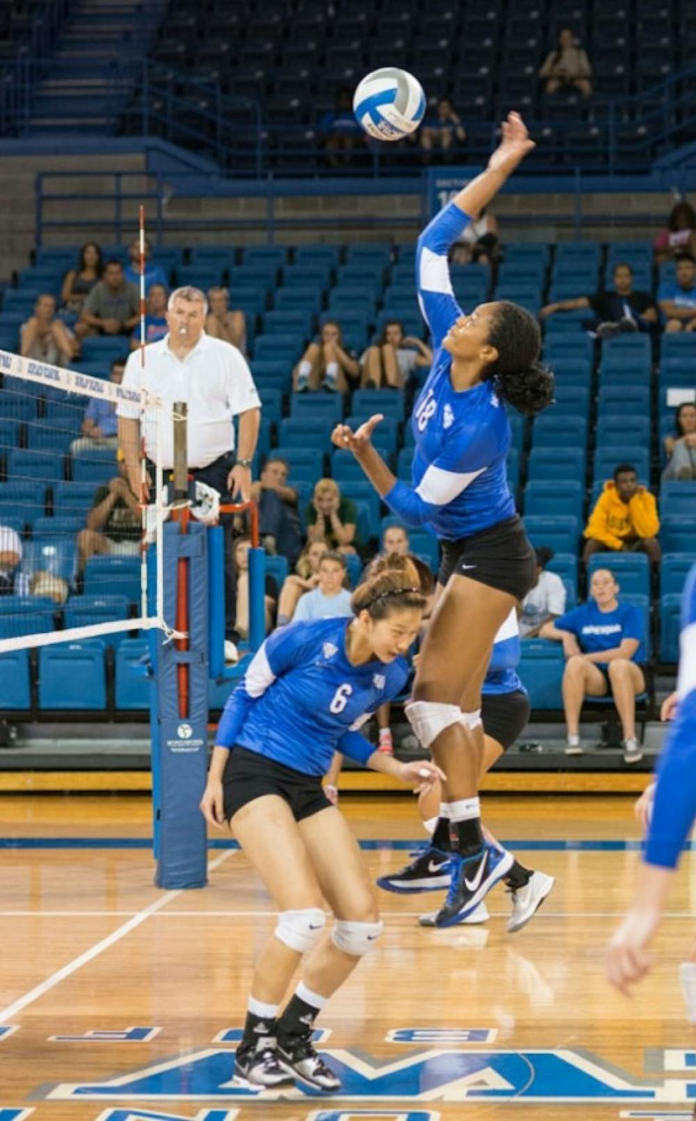 Junior outside hitter Tahleia Bishop spikes the ball during the UB Invite this weekend at Alumni Arena. The Bulls went 2-2 to open the season. Wenyi Yang, The Spectrum