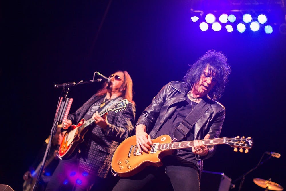 Ace Frehley (left) performs on stage at the Center for the Arts Monday night. 