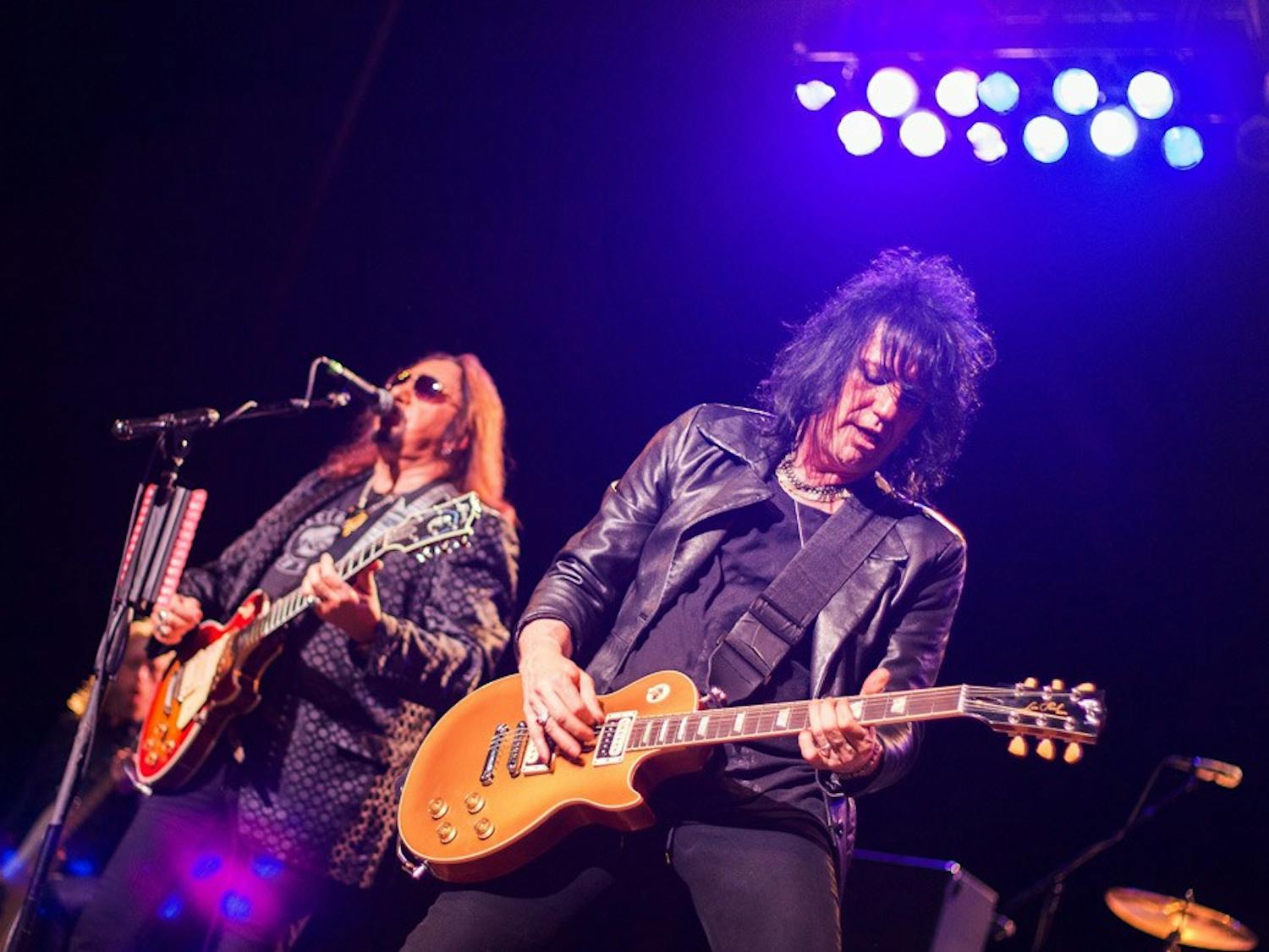 Ace Frehley (left) performs on stage at the Center for the Arts Monday night. 