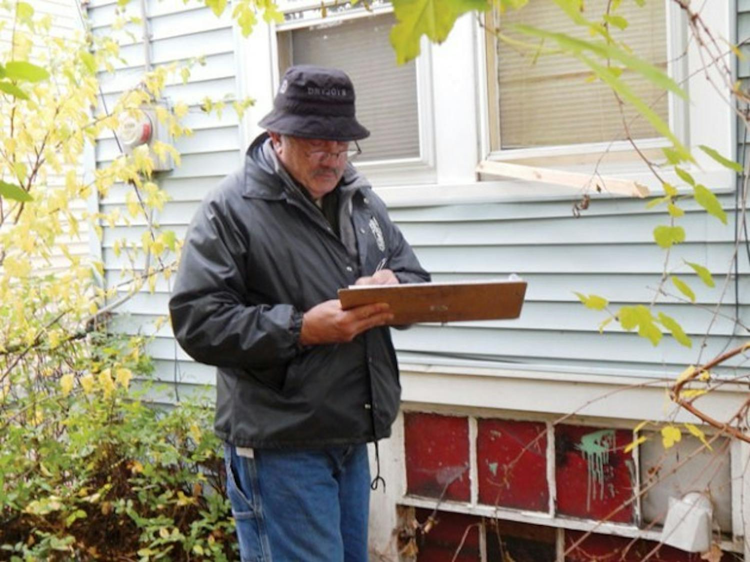 On Saturday, Daniel Ryan, director of off-campus student services, City of Buffalo inspectors conducted the first housing blitz of the year for houses surrounding South Campus. During the blitz, Charles Didio (above), an inspector found holes in the walls, exposed electrical units and faulty smoke and carbon monoxide detectors.
Samaya Abdus-Salaam, The Spectrum
