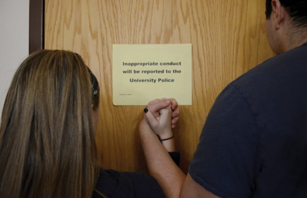 A sign posted in the Health Sciences Library on UB&#39;s South Campus discourages inappropriate conduct in the library. Some students have reported having sex various places on North and South campuses, including HSL. Photo illustration by&nbsp;Kainan Guo, The Spectrum
