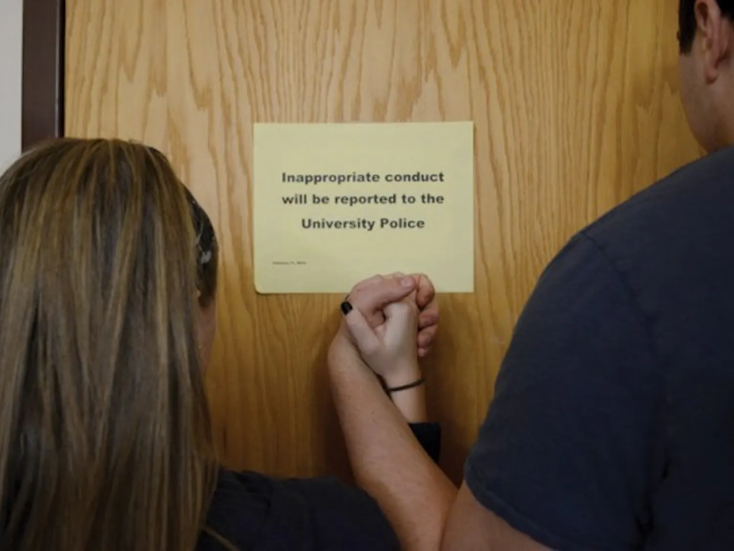 A sign posted in the Health Sciences Library on UB's South Campus discourages inappropriate conduct in the library. Some students have reported having sex various places on North and South campuses, including HSL. Photo illustration by Kainan Guo, The Spectrum