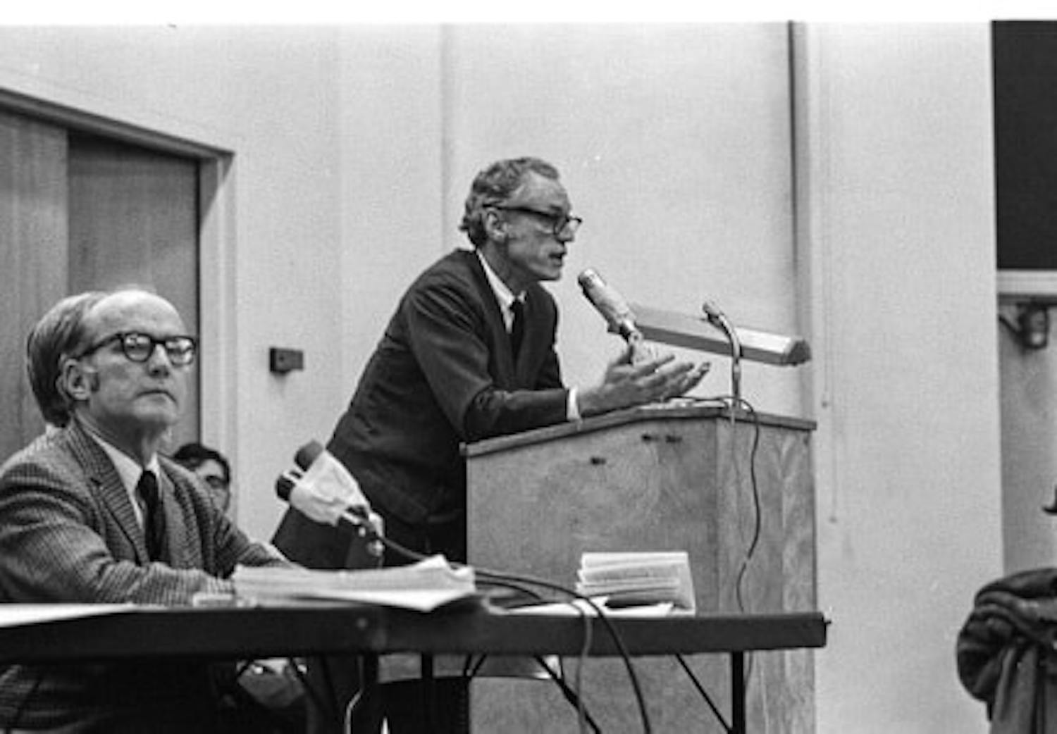 Peter Regan speaking at a faculty senate meeting in 1970.