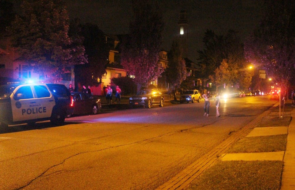 <p>Police patrol house parties on Winspear Avenue last year. Some students feel the university should focus more on crimes against students rather than partying in the University Heights neighborhood.</p>