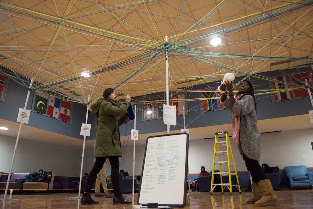<p>Students participating in the UNITY event in the SU Flag Room took pieces of yarn and connected them to poles that expressed ideas of unity and togetherness, something UB prides itself on.</p>