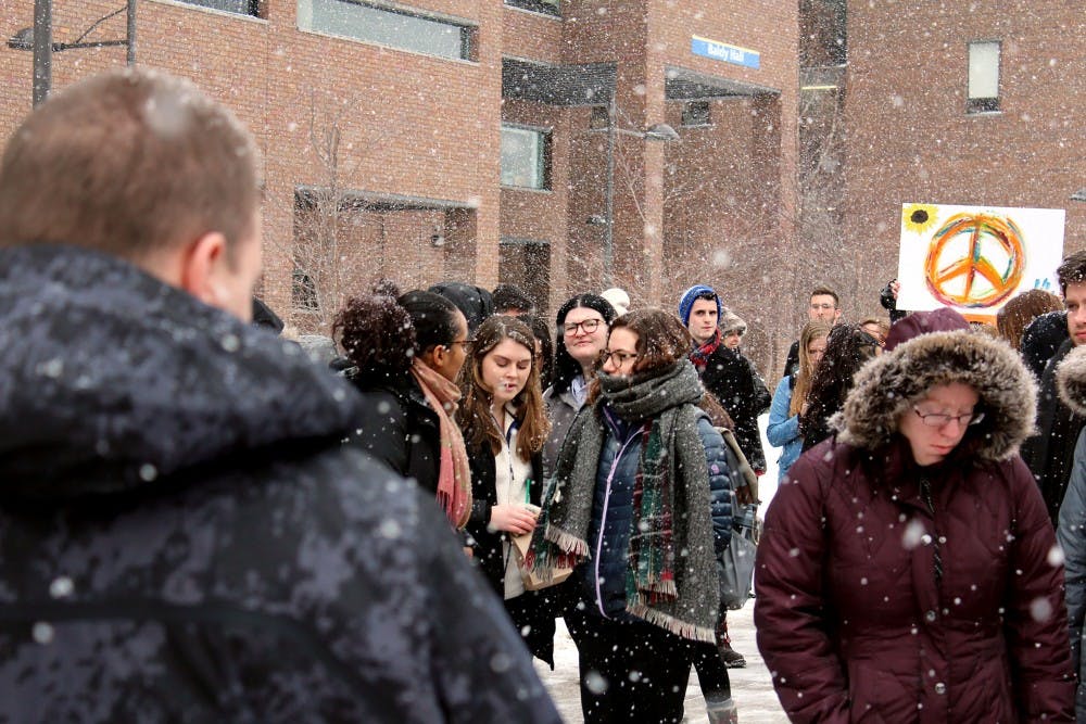 <p>UB students participating in the National School Walkout to protest gun violence on Wednesday. The protest lasted for 17 minutes to honor the 17 people killed in the Stoneman Douglas High School shooting.</p>