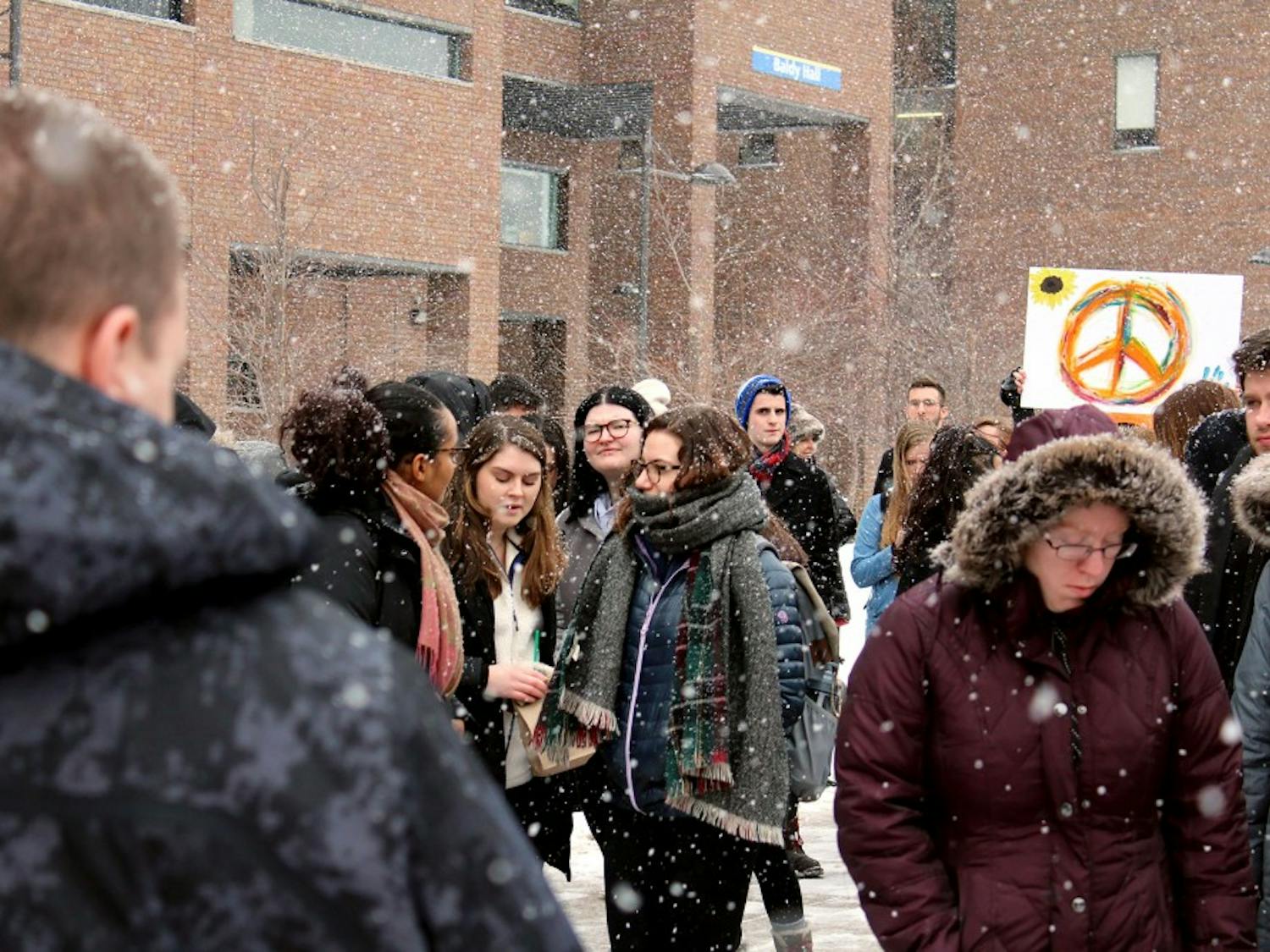 UB students participating in the National School Walkout to protest gun violence on Wednesday. The protest lasted for 17 minutes to honor the 17 people killed in the Stoneman Douglas High School shooting.