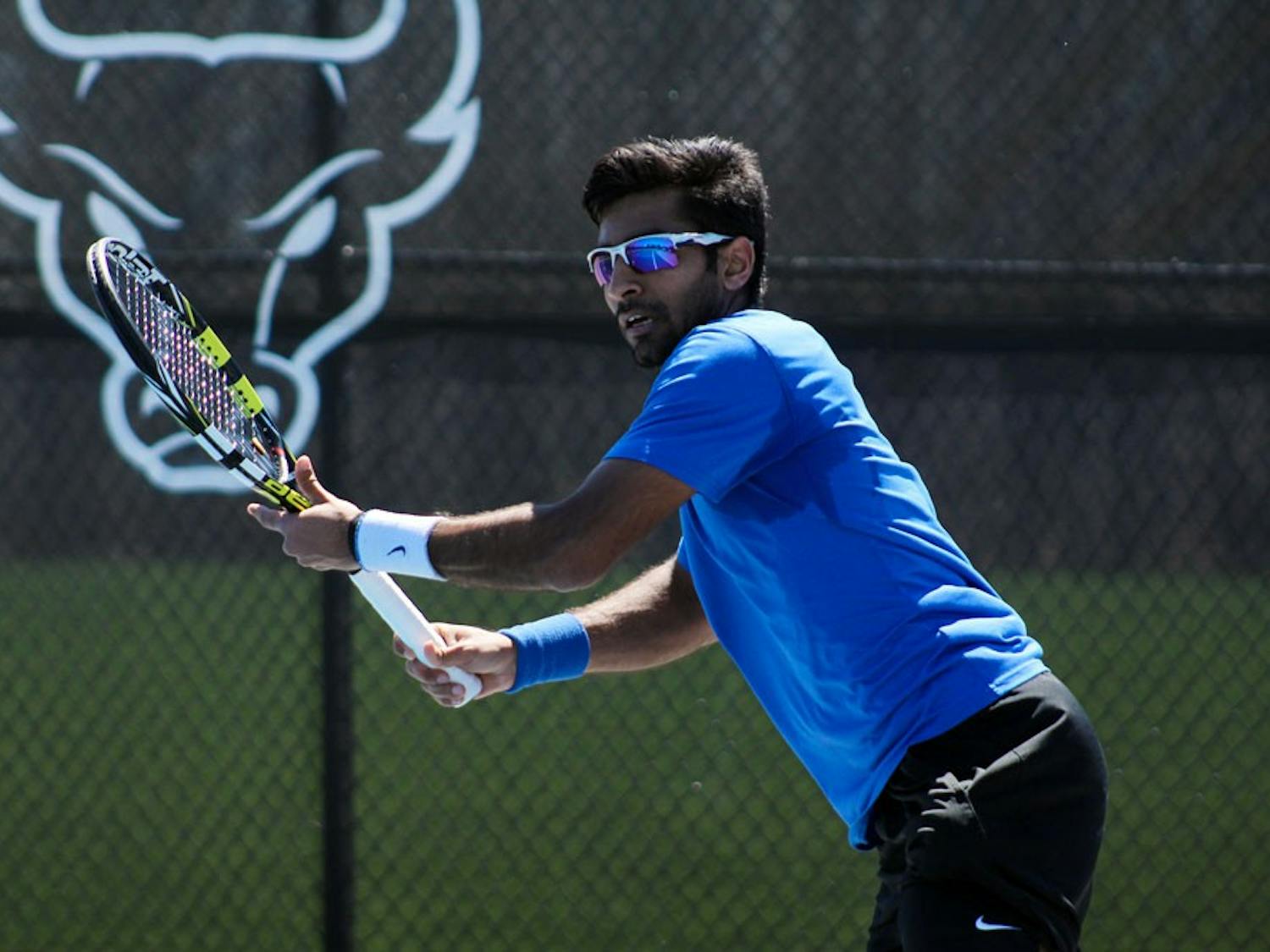 Junior Vidit Vaghela lines up a shot. Veghela won his singles matchup 4-6, 6-3, 6-1. The Bulls are now 7-0 in MAC play and the MAC regular season champions. 