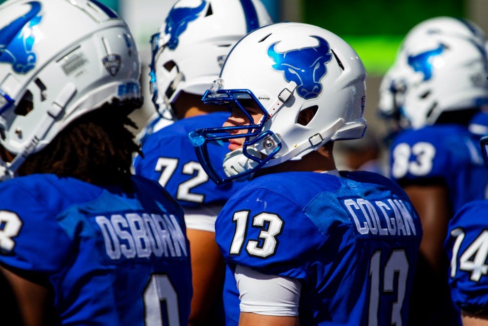 <p>UB players stand together along the sideline. The Bulls are hoping for a large crowd this weekend for UB’s homecoming and does not want to disappoint like they did against Army.</p>