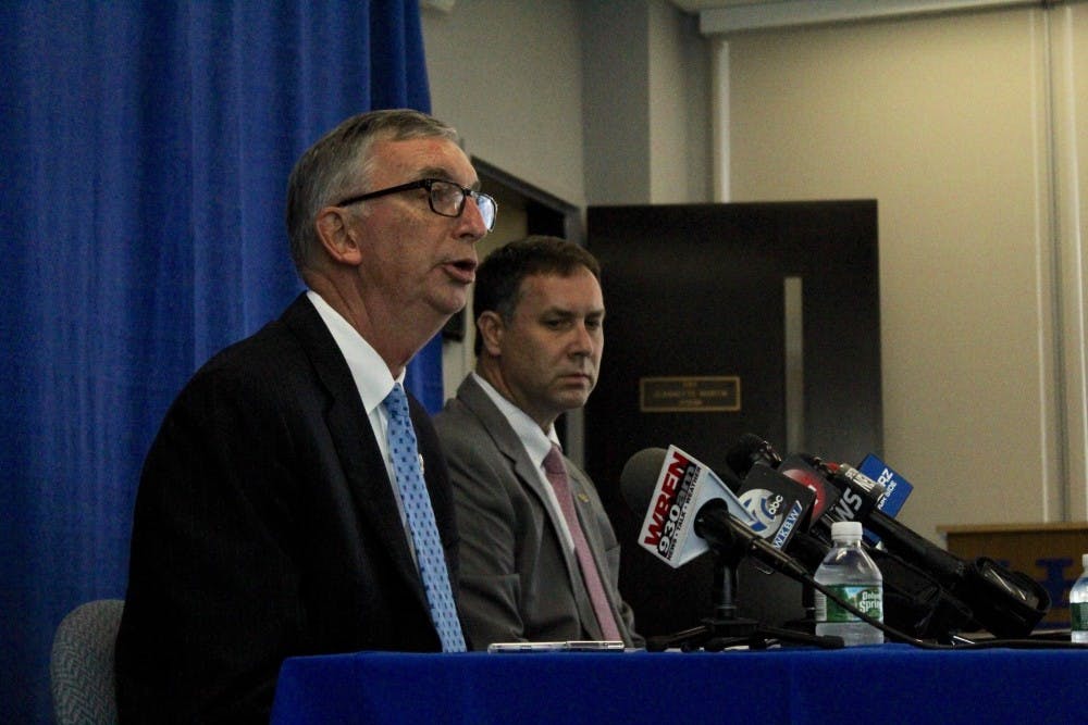 UB Vice President Scott Weber answers questions during Tuesday's briefing as  UB Spokesperson John DellaContrada looks on.