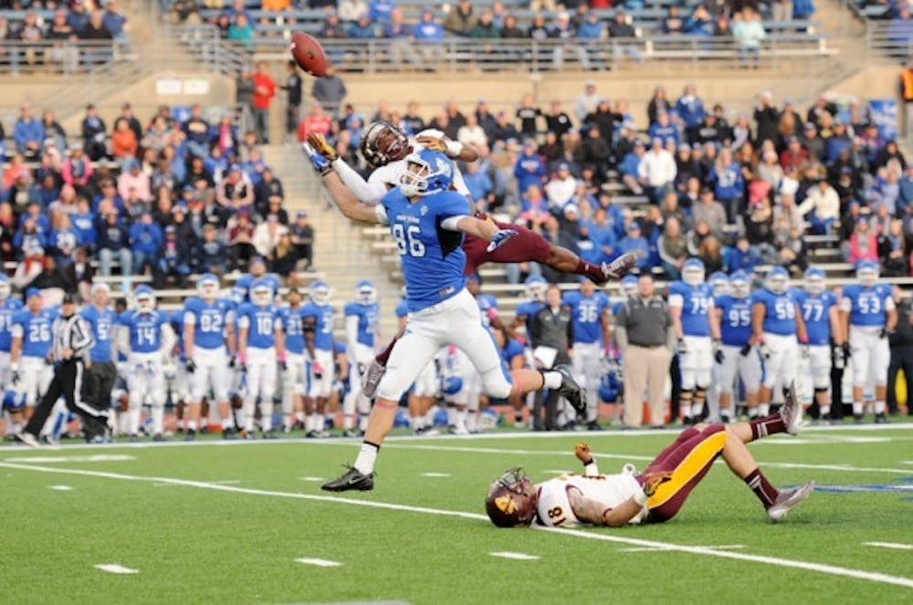 Junior wide receiver Ron Willoughby goes up for a pass during Saturday&#39;s 20-14 loss to Central Michigan. Willoughby caught four receptions for 90 yards and a touchdown. Yusong Shi, The Spectrum