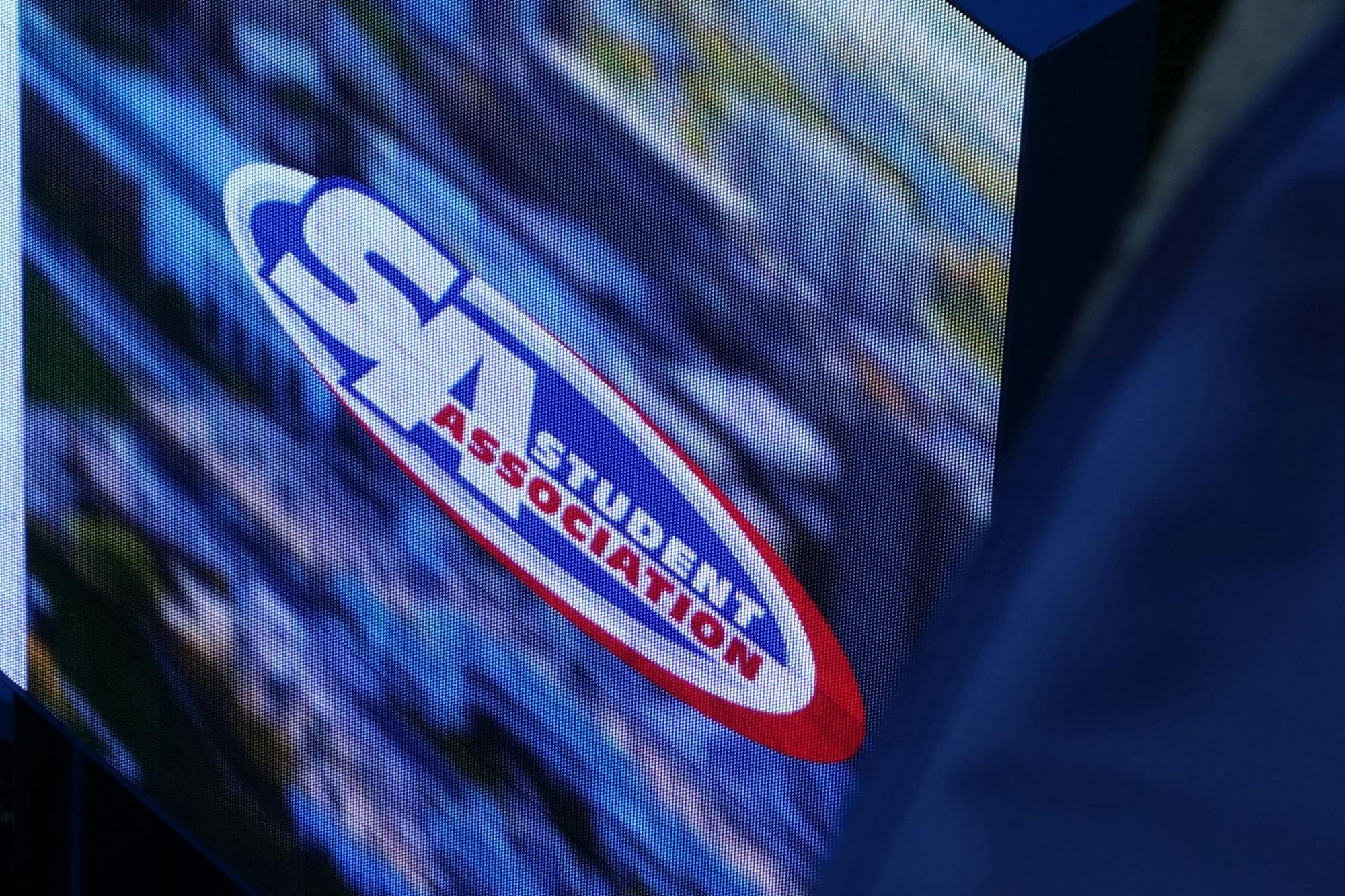 The undergraduate Student Association (SA) logo is displayed on a screen outside the Student Union.