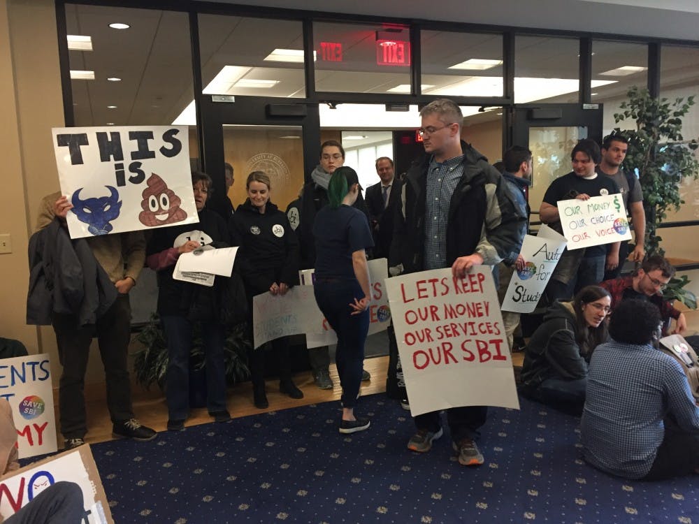 Students protest FSA as the fiscal agent for student funds on the fifth floor of Capen Hall.