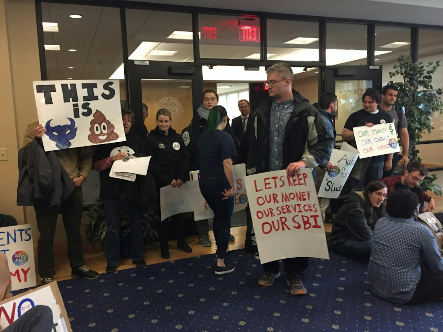 Students protest FSA as the fiscal agent for student funds on the fifth floor of Capen Hall.