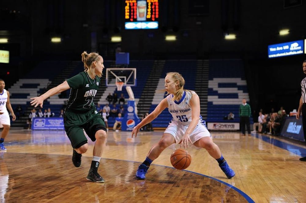 <p>Junior guard mackenzie Loesing dribbles against Ohio in a 61-50 loss to Ohio in Alumni Arena on Jan. 3. Leosing had a career-high 32 points against the Bobcats on Feb. 25, but Buffalo still fell 78-70. </p>