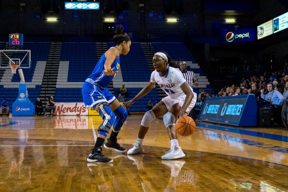 <p>Junior guard Theresa Onwuka breaks down a Delaware defender. The Bulls will need her to play well as they take on highly touted programs in their non-conference schedule.</p>