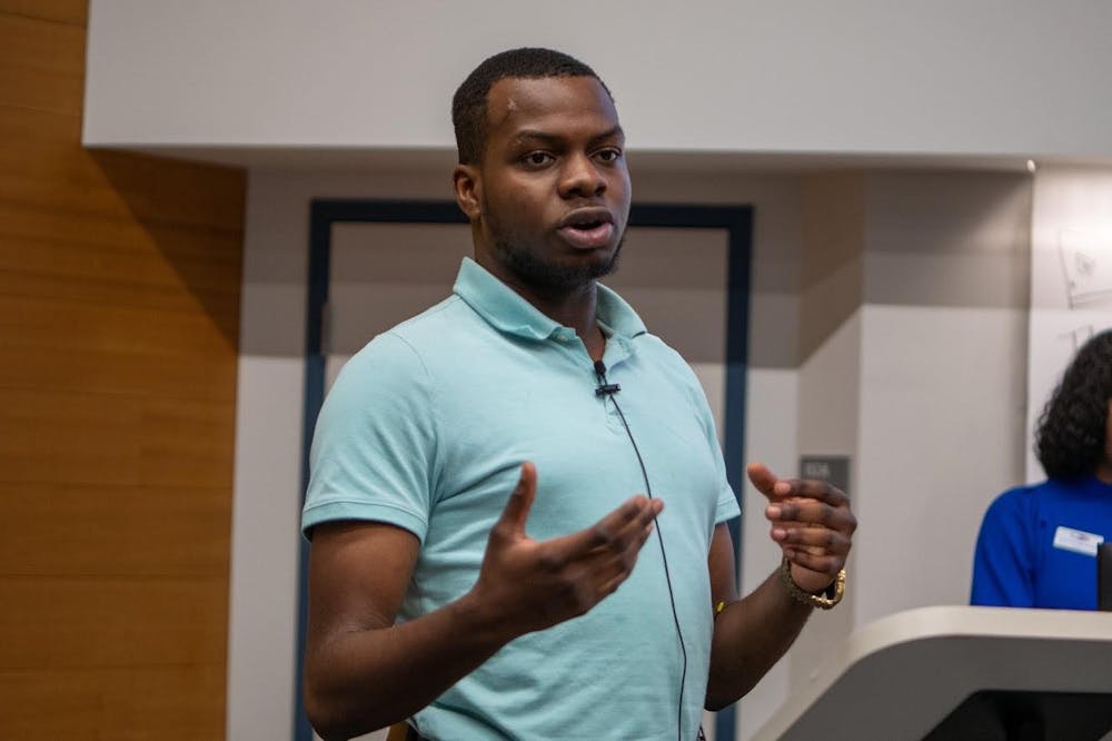 <p>&nbsp;&nbsp;SA President Yousouf Amolegbe addresses students during an SA town hall meeting in November. &nbsp;</p>