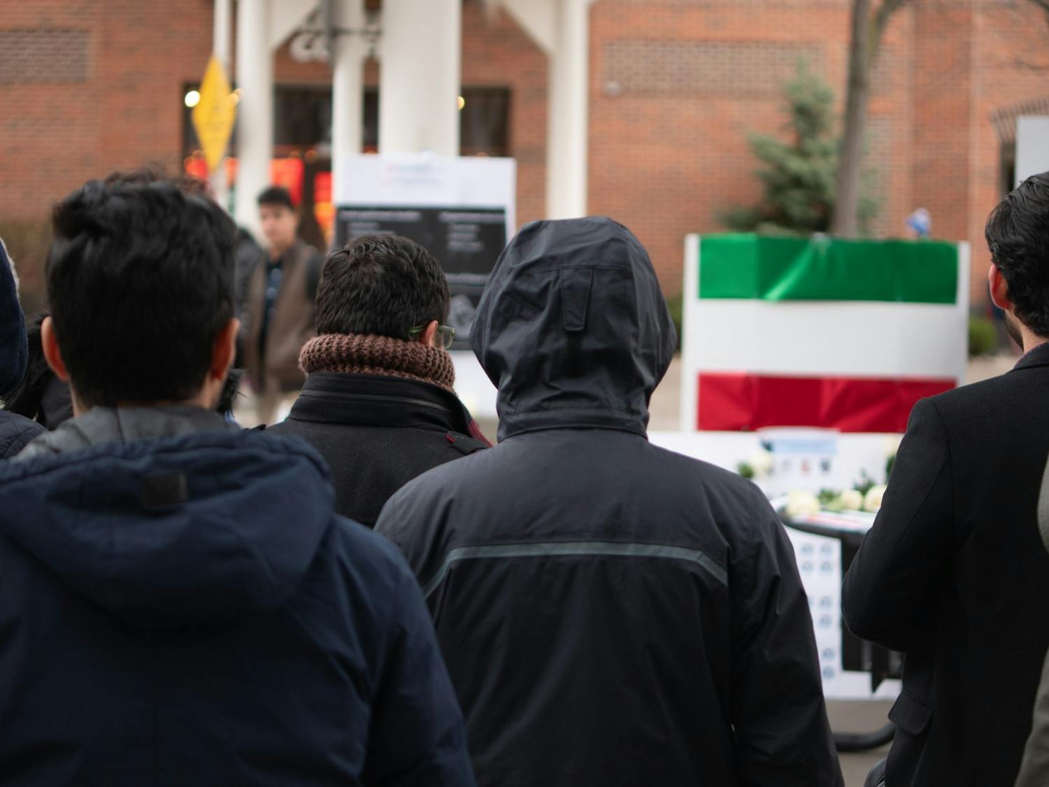 Iranian students and their supporters stand in solidarity outside Student Union on Thursday. The students brought light to the situation in Iran.