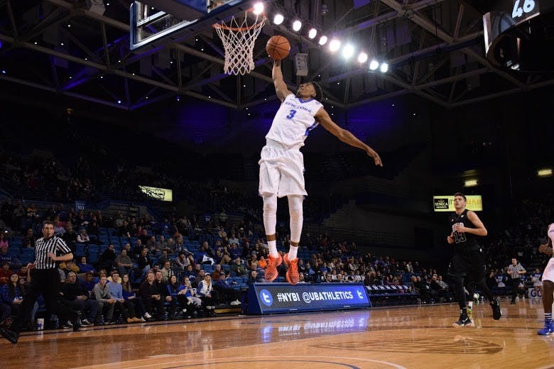Freshman guard CJ Massinburg throws down for a dunk during Buffalo's 94-75 loss to Ohio on Friday night. Massinburg scored a team-high 36 points in the loss.&nbsp;