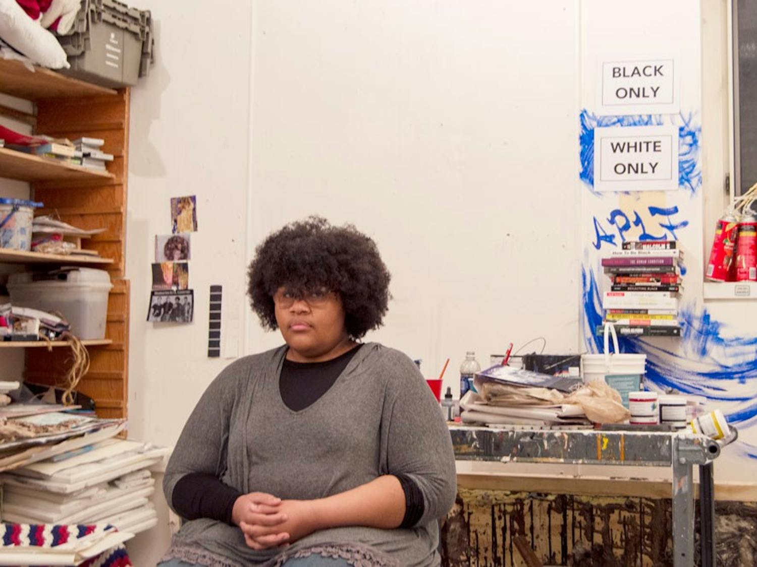 Ashley Powell, who has received both criticism and support for her “White Only, Black Only” art project, sits in her art studio in the Center for the Arts.