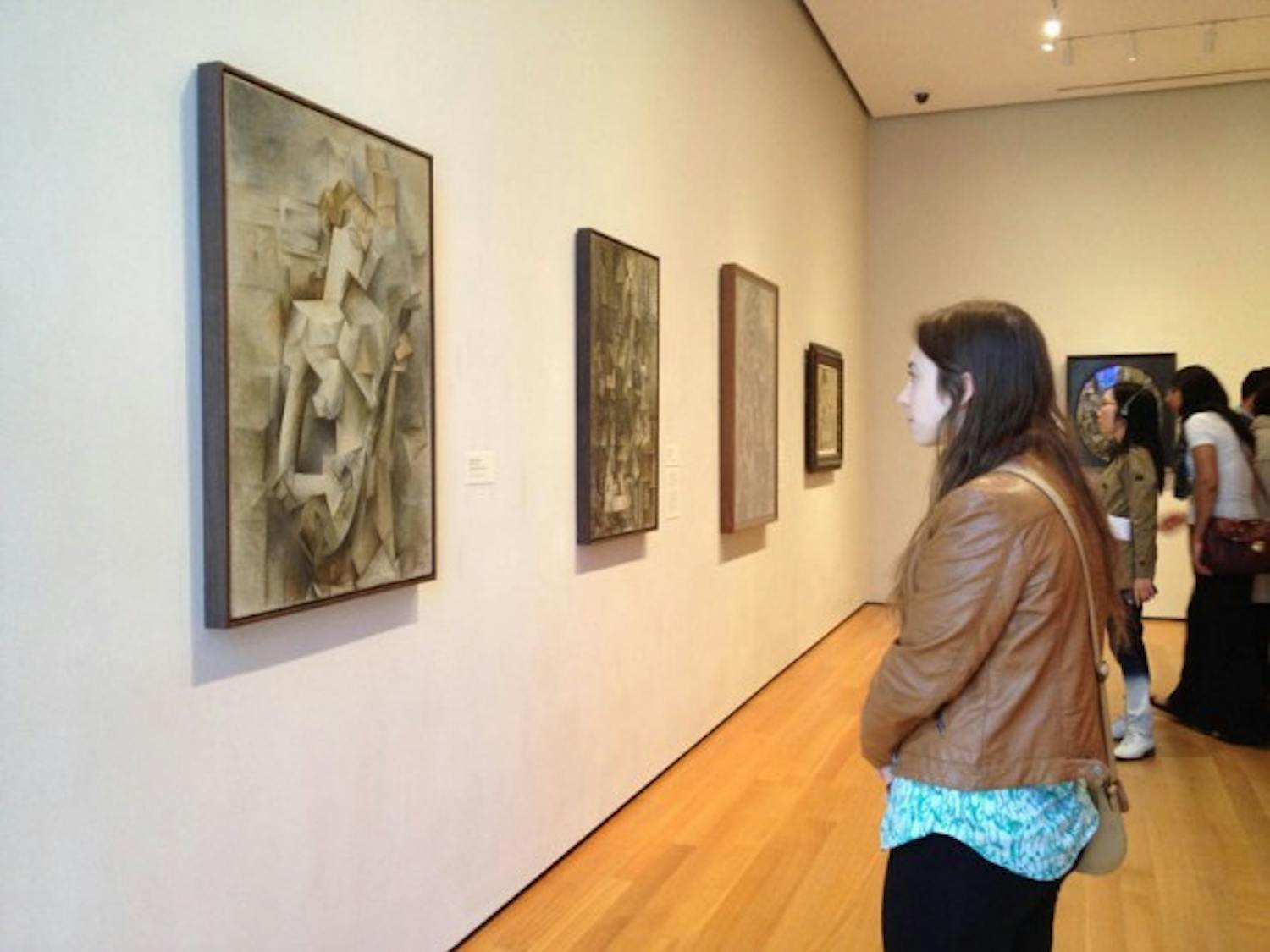 AnnMarie Agnes, a senior general studio major, observes Pablo Picasso&rsquo;s &ldquo;Girl with a Mandolin&rdquo; while on a trip to New York City with UB&rsquo;s Art Department.&nbsp;Jenna Bower, The Spectrum