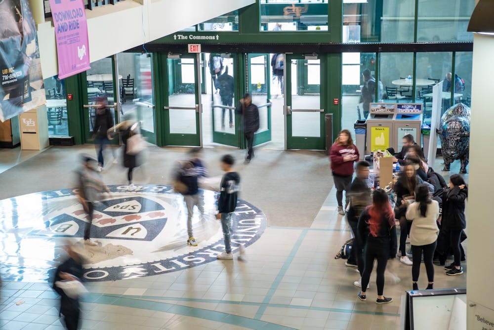<p>Students walking in the Student Union.</p>