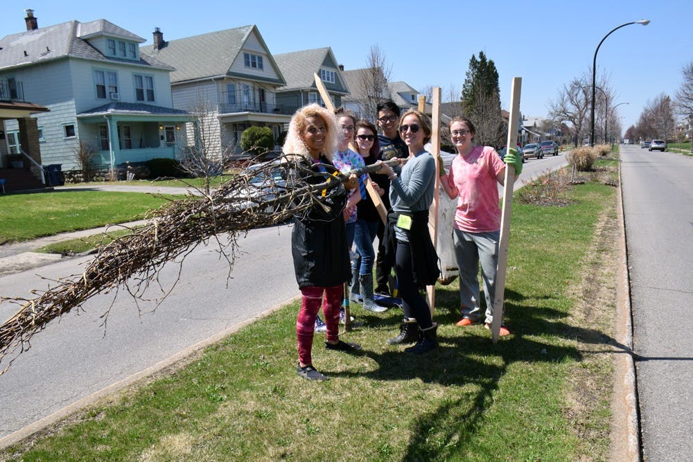 <p>(From left to right) Dominique Case, Nicole O’Heron, Emily Snyder, Brian De Guzman, Julia Schoonover, and Courtney Miller plant trees in the University Heights Saturday as a part of ReTree the District in the spring of 2015.&nbsp;</p>