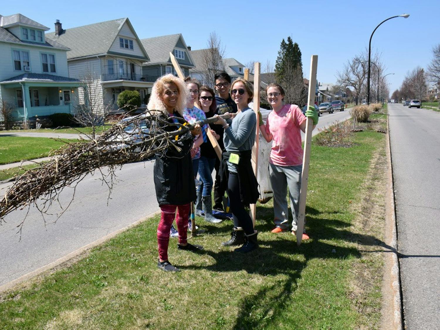 (From left to right) Dominique Case, Nicole O’Heron, Emily Snyder, Brian De Guzman, Julia Schoonover, and Courtney Miller plant trees in the University Heights Saturday as a part of ReTree the District in the spring of 2015.&nbsp;