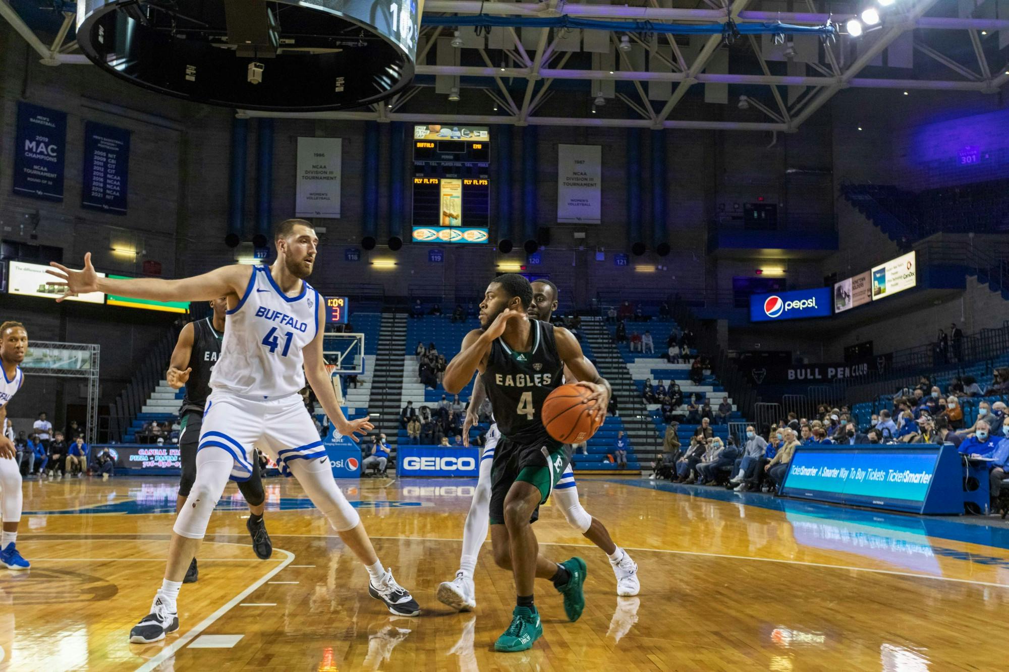 Graduate center Brock Bertram blocks an opponent in a game against the Ohio Bobcats earlier this season at Alumni Arena.