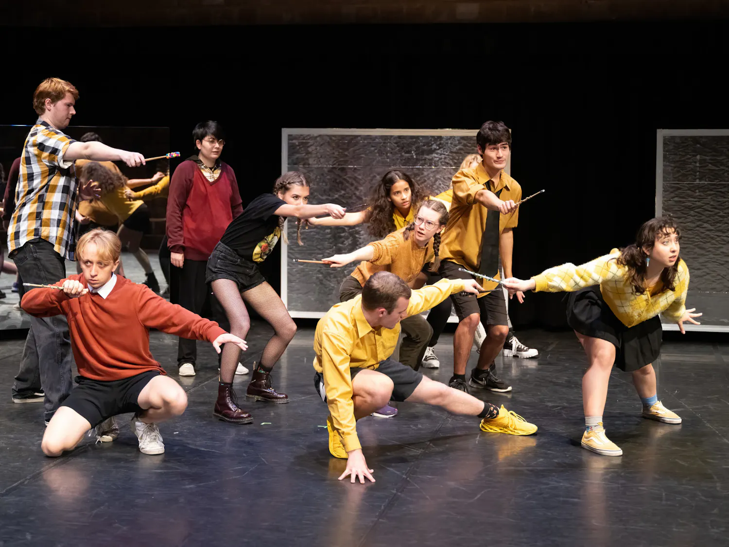 The cast of "Puffs" gathers in formation to defend Hogwarts against Voldemort in this student-directed tongue-in-cheek play on the Harry Potter universe.