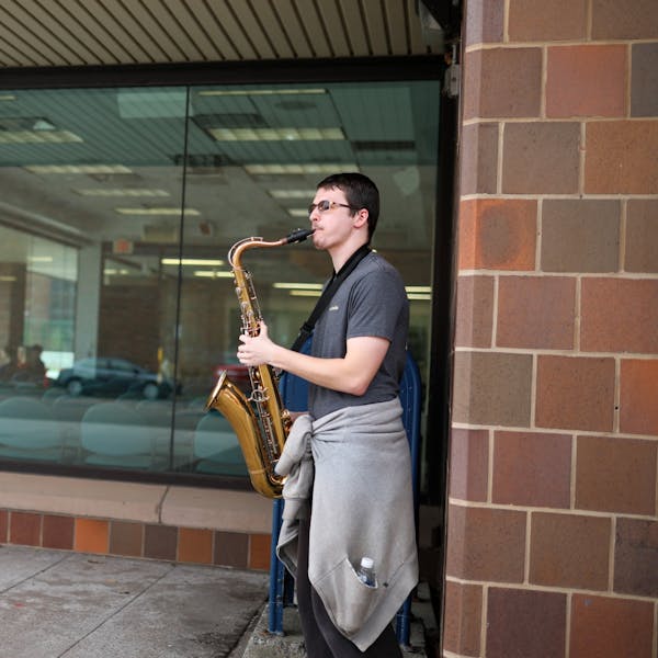 "Saxophone guy" plays outside of Capen Hall