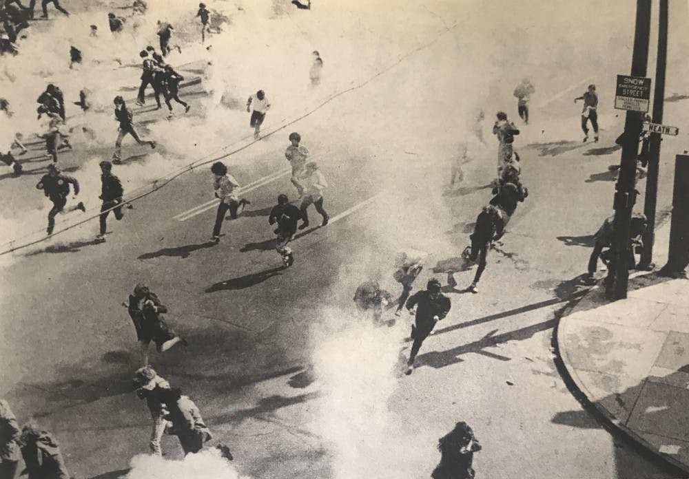 <p>Students scatter from the South Campus when police released canisters of tear gas during an anti-Vietnam War demonstration.</p>